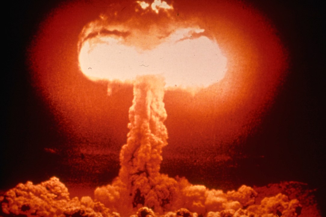 A picture containing hydrogen bomb, weapon, smoke, dark

Description automatically generated